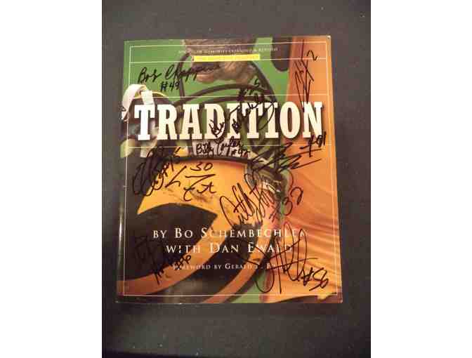 TRADITION book signed by Charles Woodson and 22 other Michigan greats.