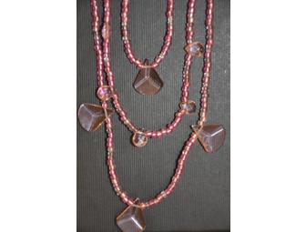 Six handmade beaded necklaces.