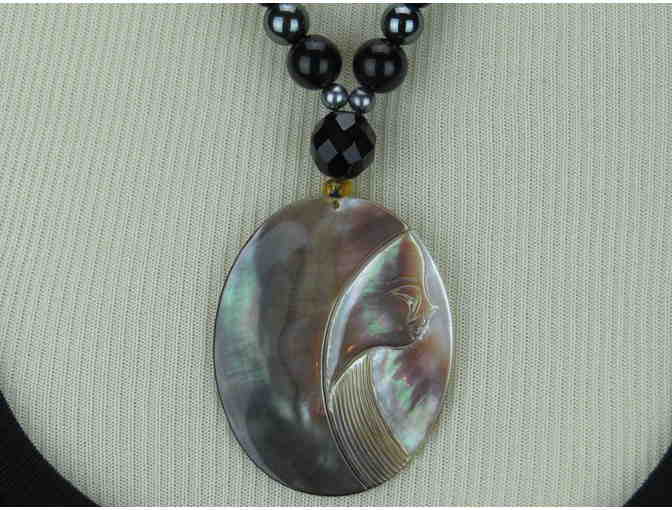 1/KIND Timeless Necklace features Paua Shell Profile Pendant, Pearls, Onyx, and Hematite!
