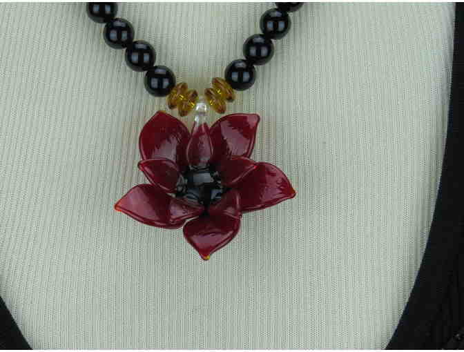 ! Romantic, Necklace features a Beautiful Art Glass Flower on a strand of Genuine Onyx!