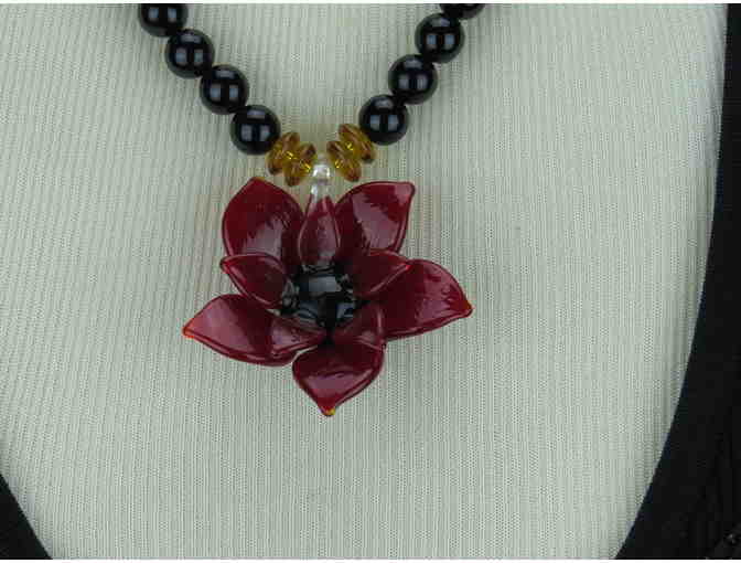 Romantic, Necklace features a Beautiful Art Glass Flower on a strand of Genuine Onyx!