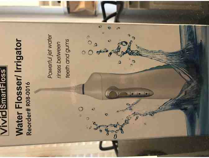 Two (2) Teeth Whitening Kits and 1 Water Flosser