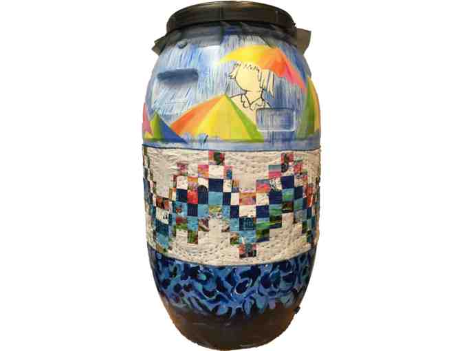 Painted and fiber art covered rain barrel by Catlin Rice, Eva Maier and Julie Ireland