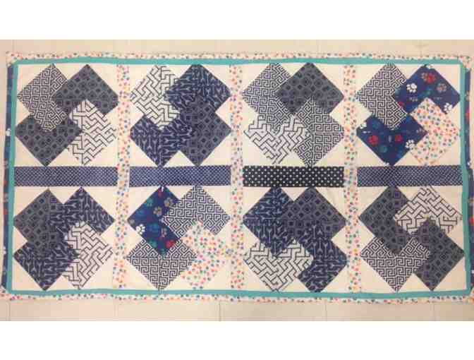 Alice Model: Handmade Blue & White Toddler Quilt with Colorful Paw Print Piping & Patches