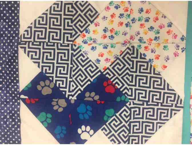 Alice Model: Handmade Blue & White Toddler Quilt with Colorful Paw Print Piping & Patches