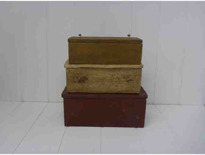 Set of antique looking wooden storage boxes