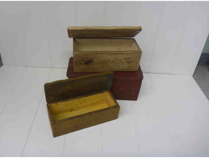 Set of antique looking wooden storage boxes