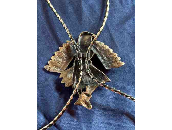 Silver metal and leather Native American eagle bolo tie