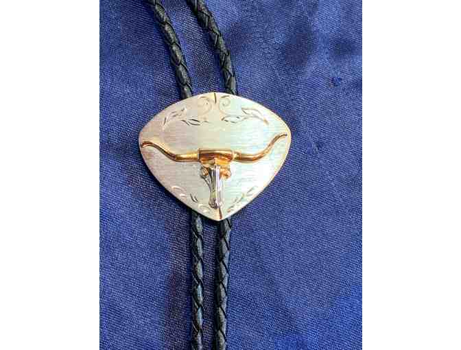 Silver and gold tone metal steer head bolo tie