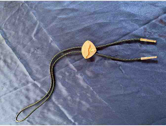 Silver and gold tone metal steer head bolo tie