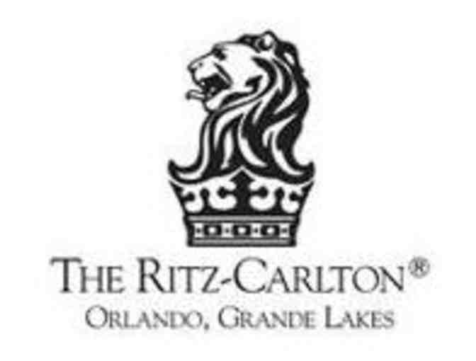 A foursome at The Ritz-Carlton Golf Club at Grande Lakes in FL.