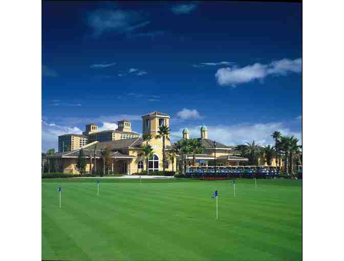 A foursome at The Ritz-Carlton Golf Club at Grande Lakes in FL.