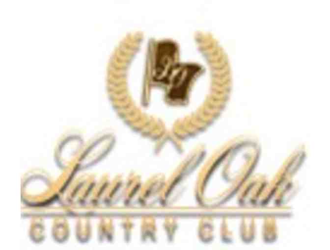 One foursome with carts at Laurel Oak Country Club in Sarasota, FL .