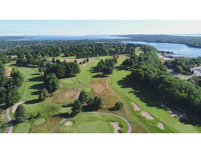 Traverse City Country Club - a foursome with carts and range balls