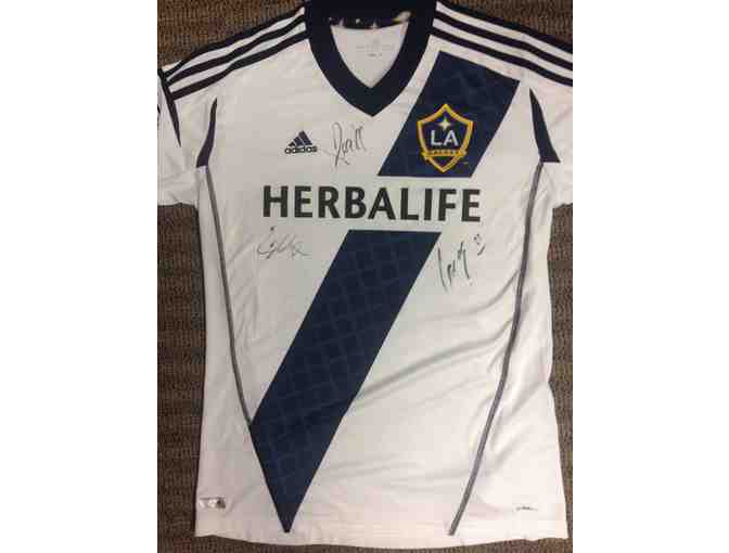 Galaxy jersey signed by One Direction members Louis Tomlinson, Niall Horan, and Liam Payne