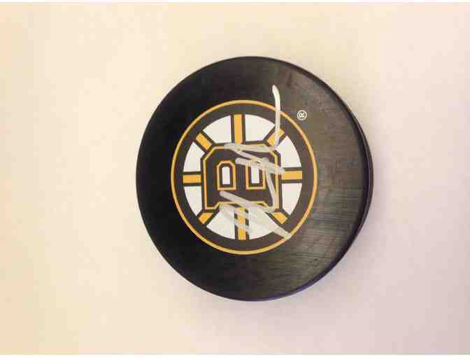 Boston Bruins v. Florida Panthers tickets and a Kevan Miller autographed hockey puck
