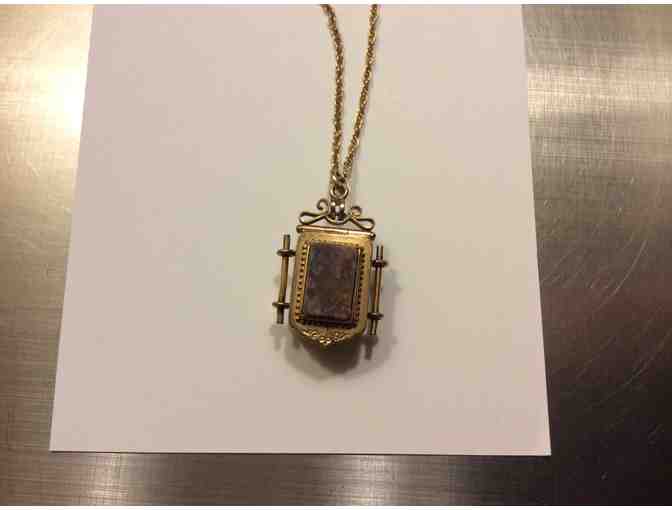 Unusual Bottom to top opening locket with 2 different colored stones