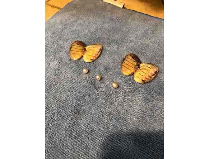 Three cultured pearls