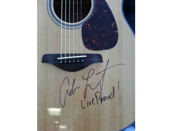 Yamaha acoustic guitar signed by Adam Lambert