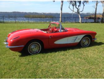 Notch up your cool when you drive this classic 1960 red convertible Corvette!