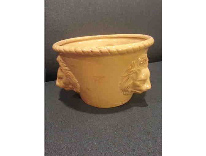 Ceramic yellow pot with lion figures
