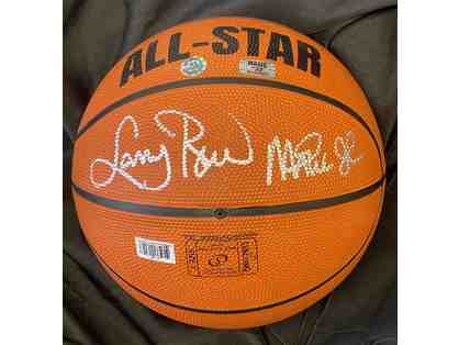 Magic Johnson and Larry Bird signed basketball in display case