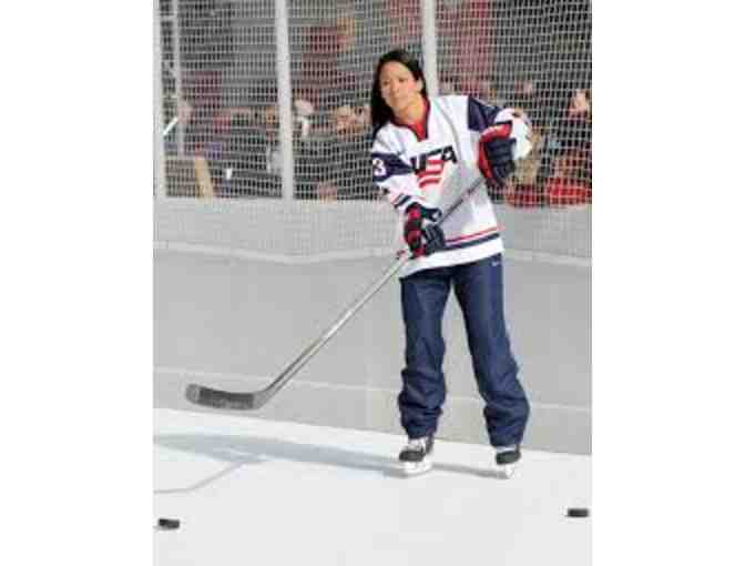 Autographed puck by Women's Olympic Hockey forward Julie Chu