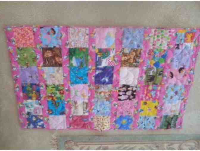 Pink childs patchwork quilt.