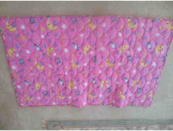 Pink childs patchwork quilt.