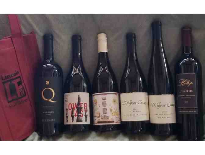 6 Bottles of fine wine in a special carrier bag