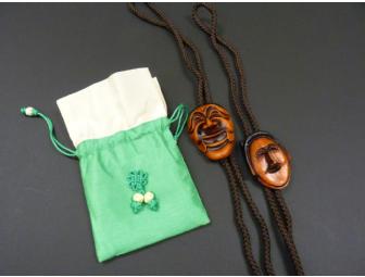 SET OF TWO SMALL KOREAN MASKS IN SILK BAG