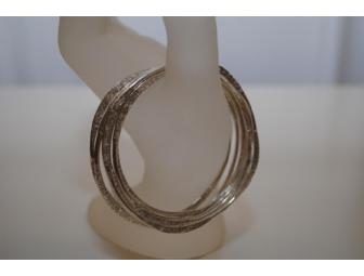 Sterling silver, hand-formed bangles by Jody Stokes