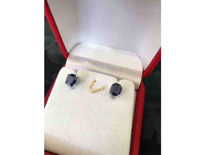 Pair of oval sapphire earrings set in sterling prong setting.
