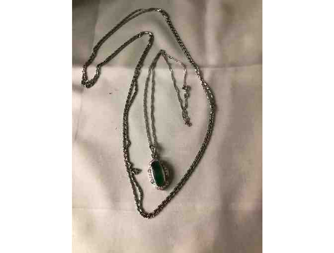 Long silver chain with second necklace and green pendant