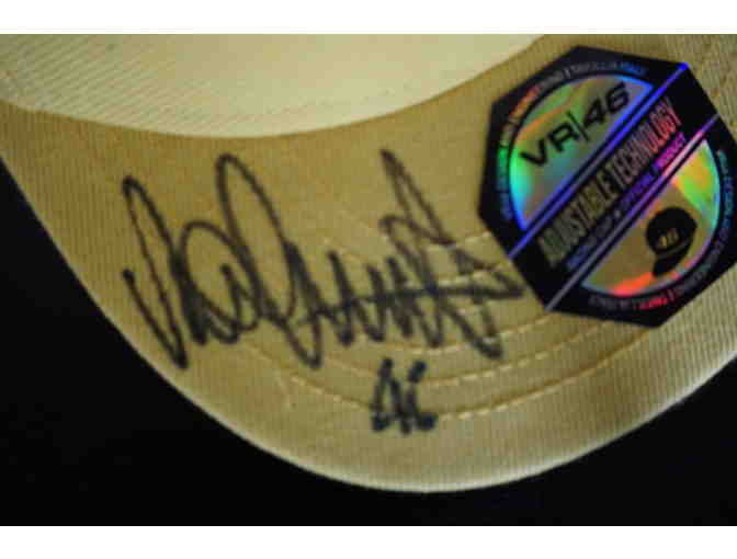 Valentio Rossi autographed hat with T-Shirt possibly the Greatest Moto GP Racer ever!
