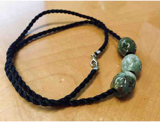 Three Carved Jade Beads on Black Cord