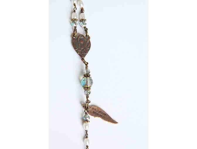 BMHS Principal Ms. Rosemary Libbon's Basket: Seraphym Rosary, 2 Books, and Framed Photos