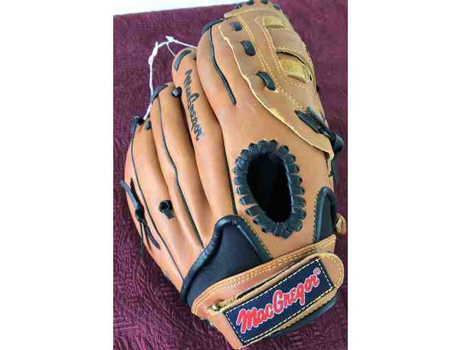 New Baseball Glove and Used Baseball Batting Helmet