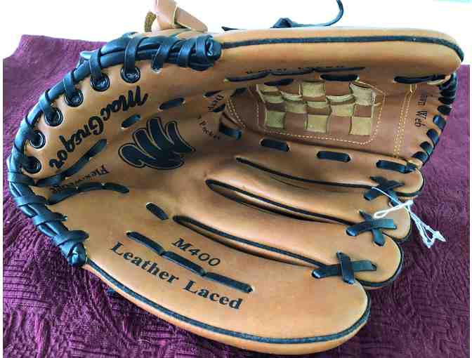 New Baseball Glove and Used Baseball Batting Helmet