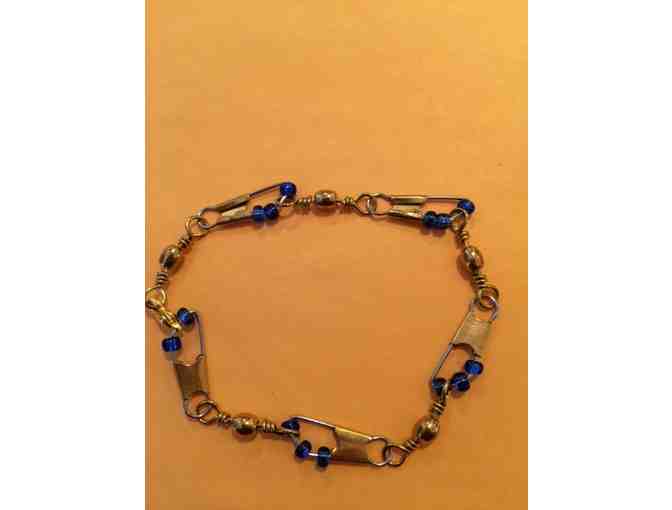 Brass swivel bracelet and earrings with blue beads