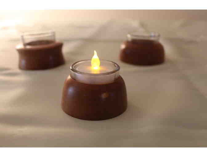 Three turned cherry votive candle holders