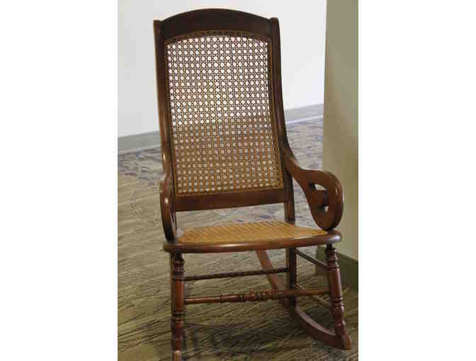 Cherry rocking chair with caned back and seat