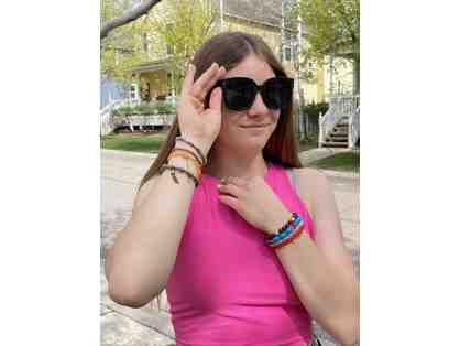 2 pairs of sunglasses and 8 bracelets from Fourth Dimension Clothing Boutique
