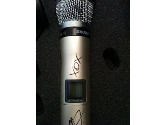 Christina Aguilera sung into and signed her wireless Shure SM86 microphone