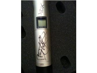 Christina Aguilera sung into and signed her wireless Shure SM86 microphone