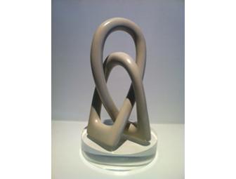 Hand-carved African soapstone sculpture on lucite stand