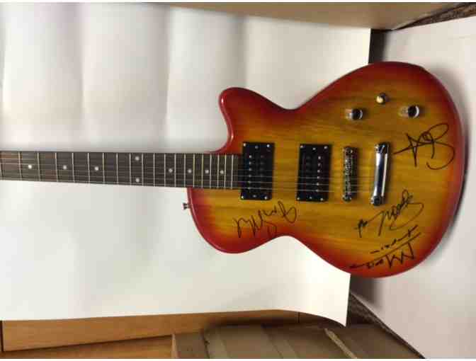 Guitar autographed by Train