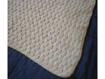 Hand-crocheted blue and pink baby blanket