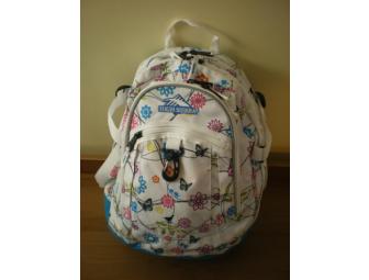 Girl's backpack filled with school supplies