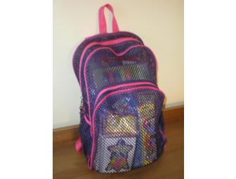 Pink backpack filled with teaching supplies